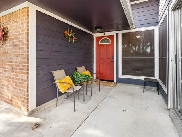 a view of a brick house with a patio