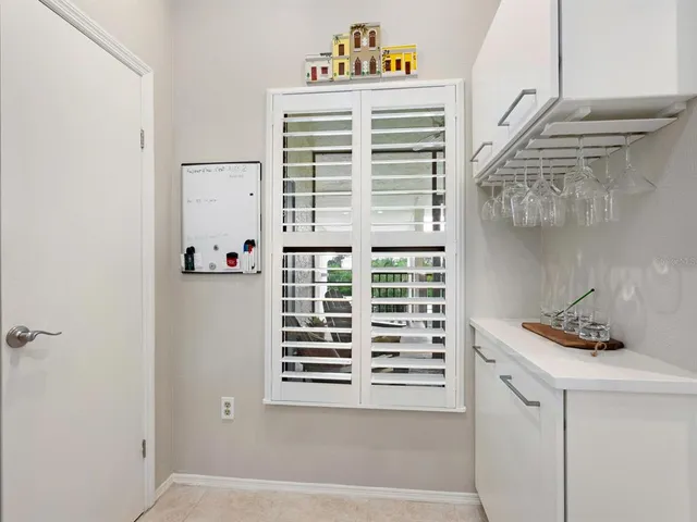 a kitchen with a sink and refrigerator