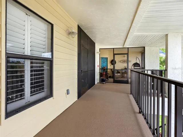 a view of a porch with wooden floor and stairs