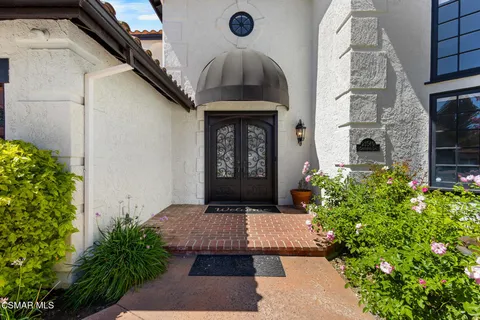a living room with furniture potted plant and a fireplace