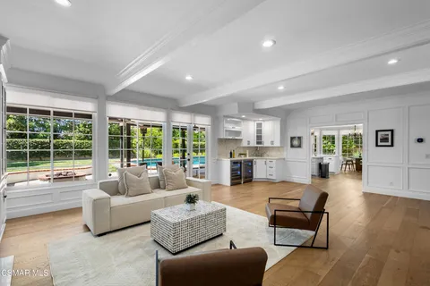 a kitchen with stainless steel appliances granite countertop a stove and cabinets