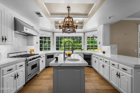 a bathroom with a toilet sink vanity and mirror