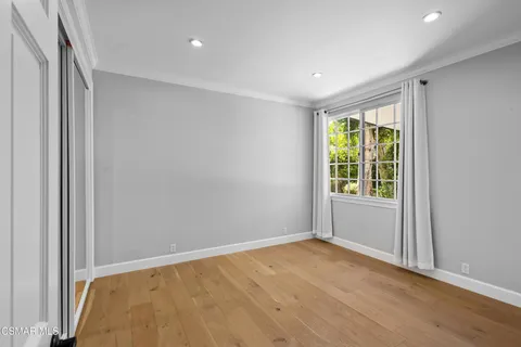 a view of a kitchen with a sink and cabinets