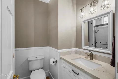 a living room with furniture a fireplace and a table