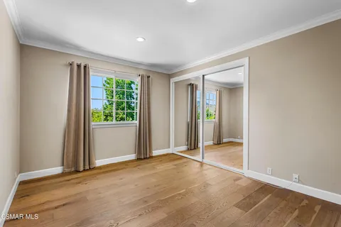 a front view of a house with swimming pool having outdoor seating