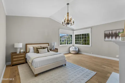 a view of a patio with a table chairs and a backyard