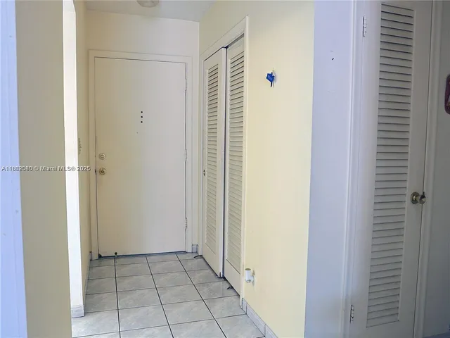 a view of a bathroom from a hallway