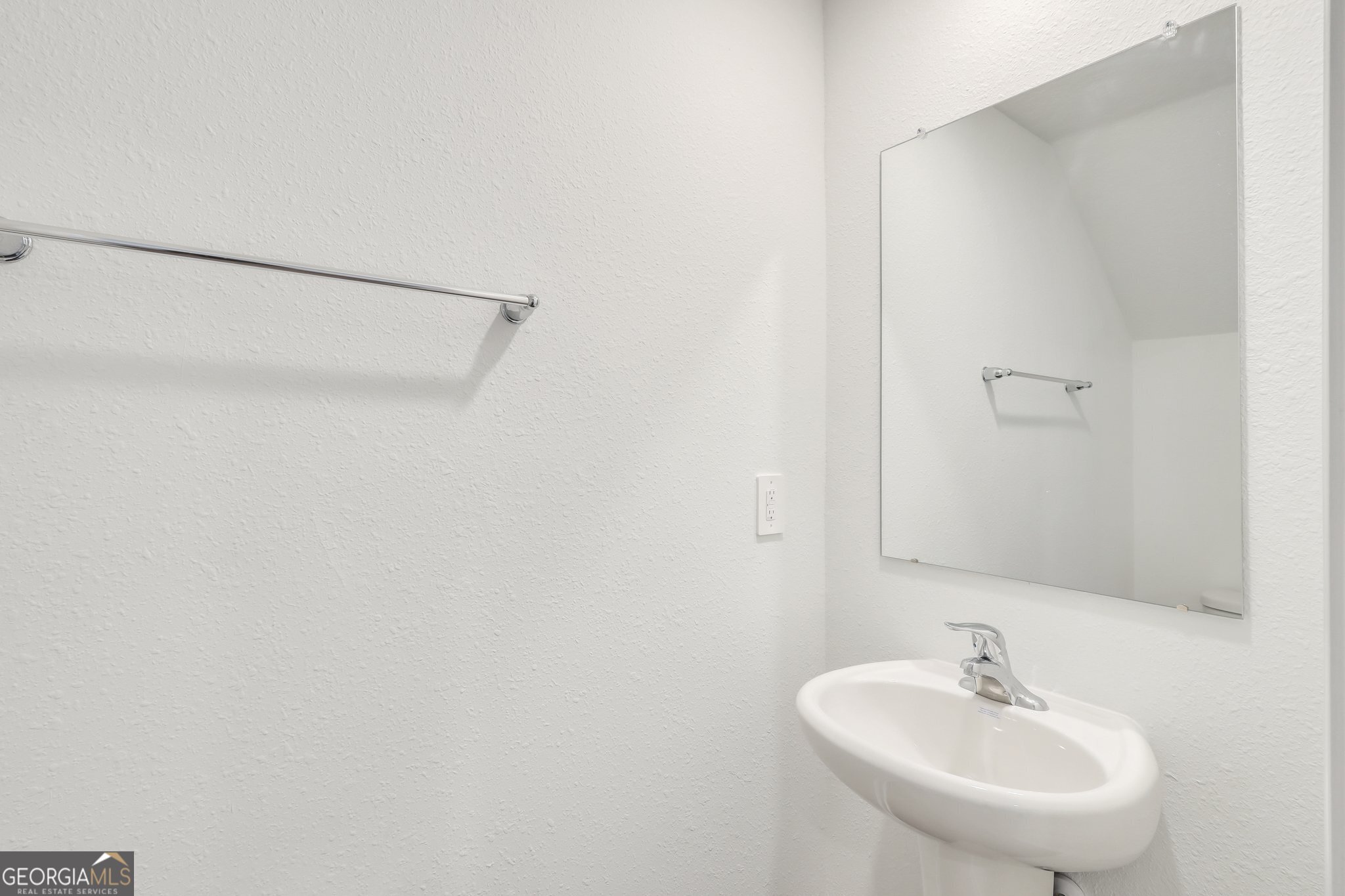 150 Inlet Reach Circle St. Marys, GA 31558 - Photo 12 of 27 a bathroom with a sink and a mirror