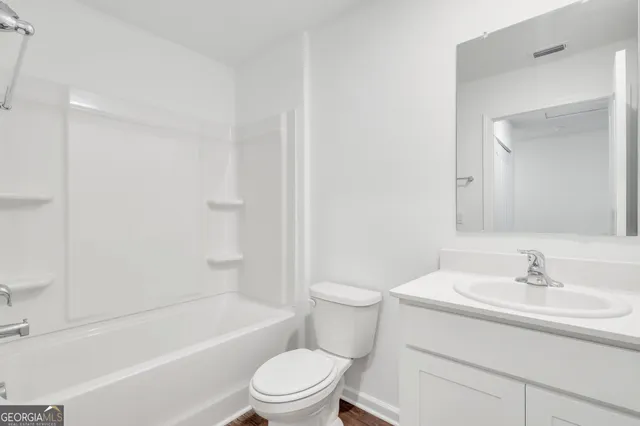 a bathroom with a sink toilet and a bathtub