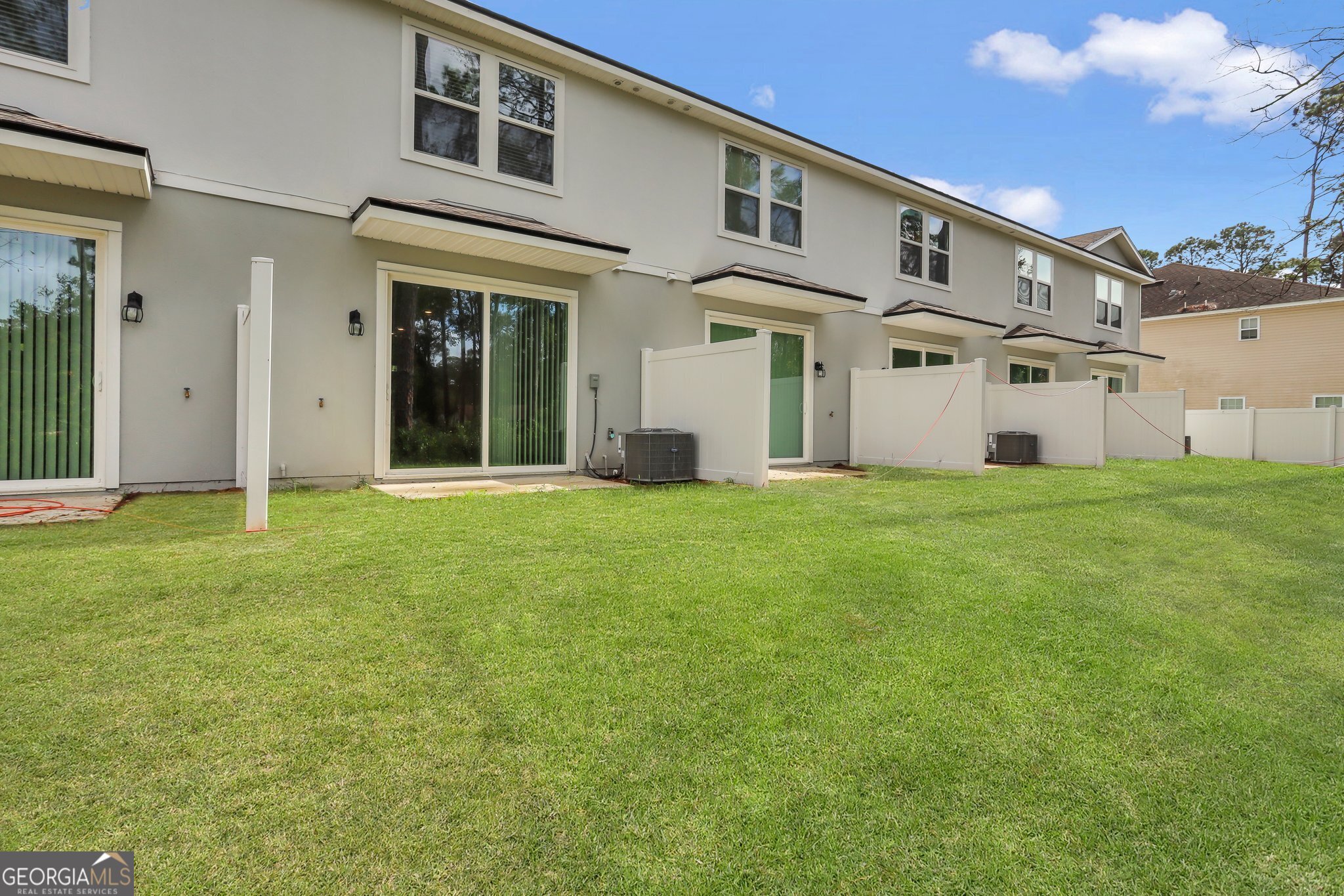 150 Inlet Reach Circle St. Marys, GA 31558 - Photo 27 of 27 a view of a white house with a big yard and large trees