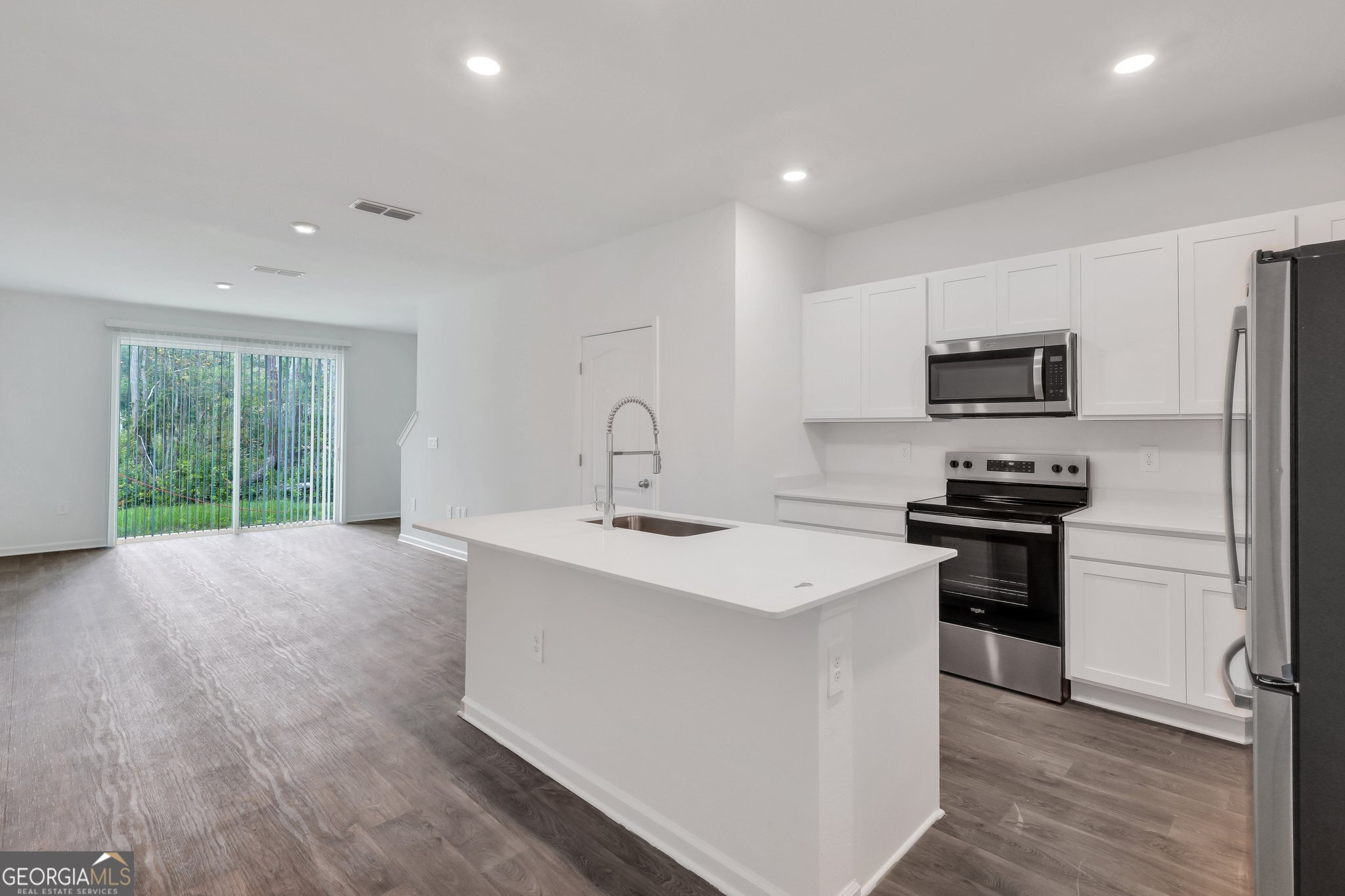 150 Inlet Reach Circle St. Marys, GA 31558 - Photo 6 of 27 a kitchen with stainless steel appliances a sink stove and refrigerator