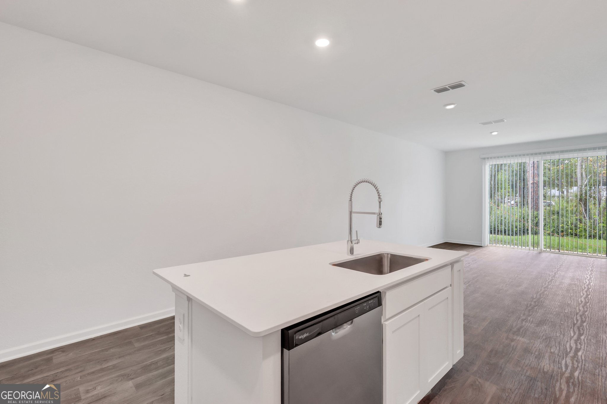 150 Inlet Reach Circle St. Marys, GA 31558 - Photo 8 of 27 a kitchen that has a sink and a wooden floor