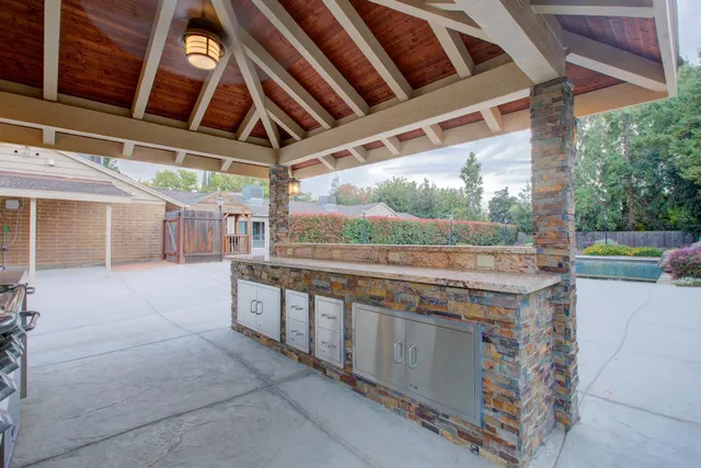 a view of backyard with sitting area