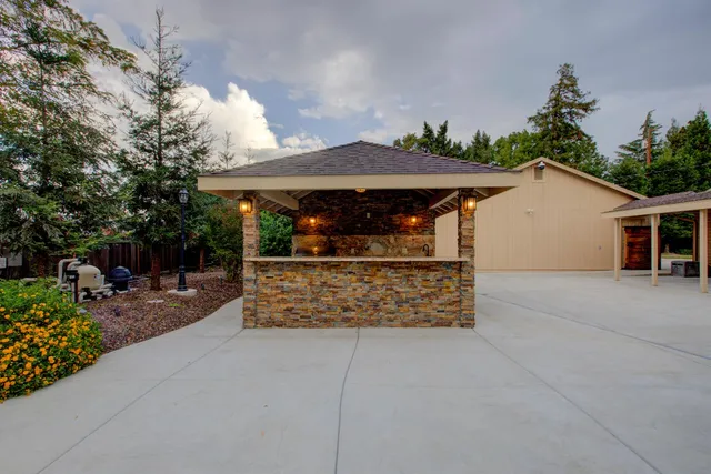 a view of a patio with a backyard