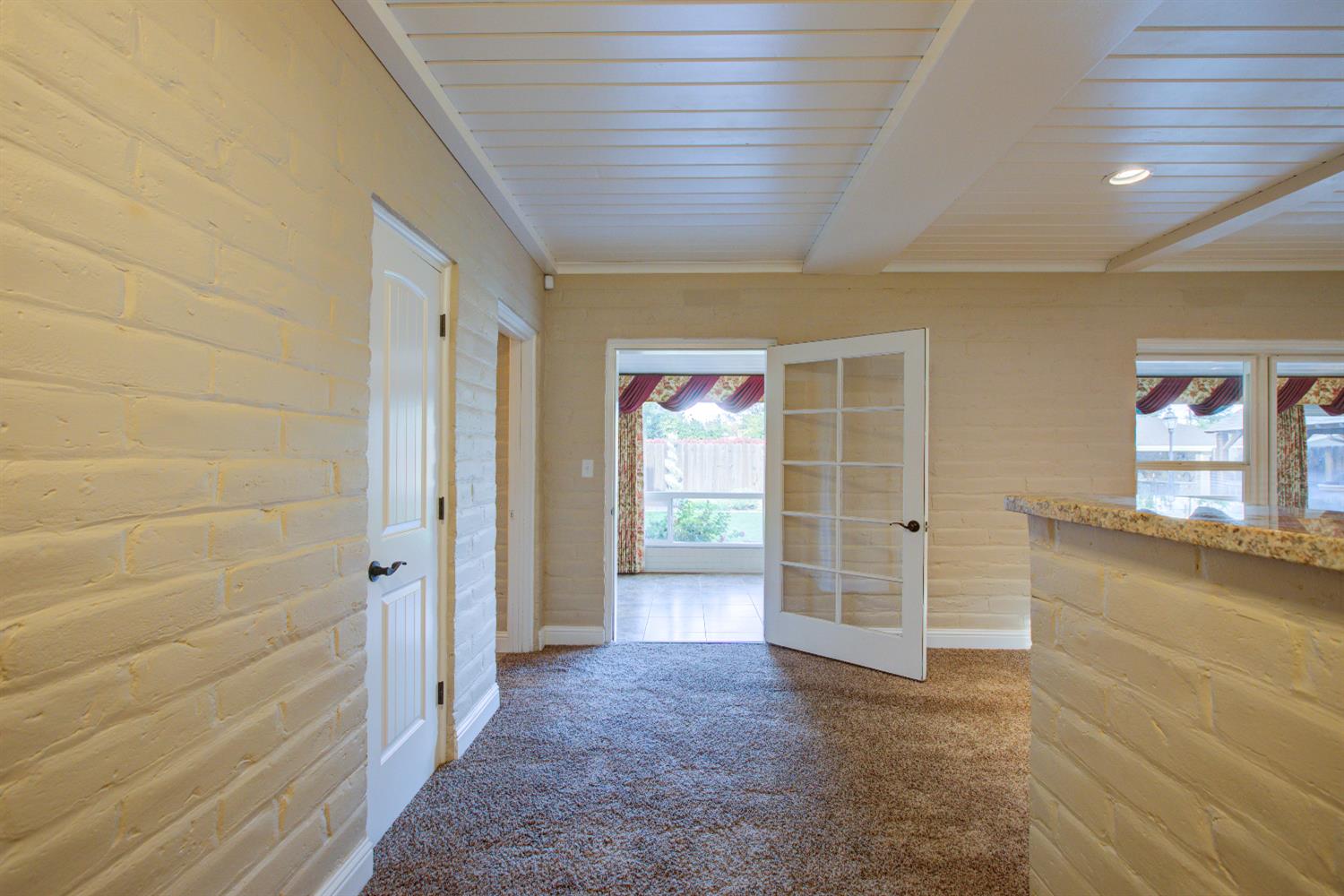 1739 First Street Atwater, CA 95301 - Photo 17 of 58 a view of a hallway with wooden shelves