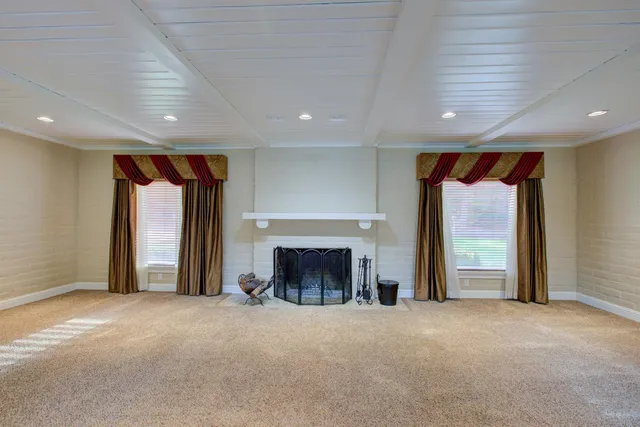 a view of wooden floor and chandelier in a room