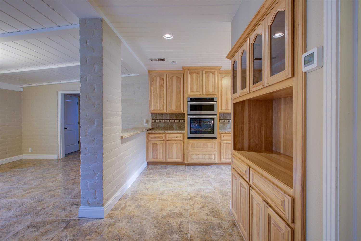 1739 First Street Atwater, CA 95301 - Photo 25 of 58 a kitchen with cabinets and oven