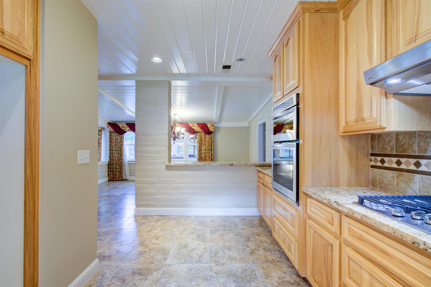 1739 First Street Atwater, CA 95301 - Photo 27 of 58 a view of a hallway with wooden floor and staircase