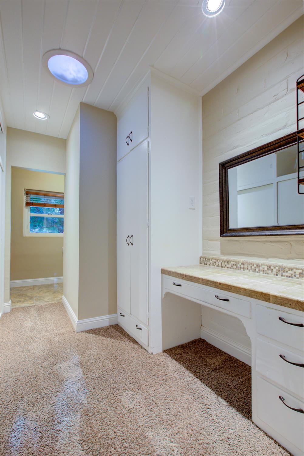 1739 First Street Atwater, CA 95301 - Photo 31 of 58 a view of a hallway and a bathroom with a sink