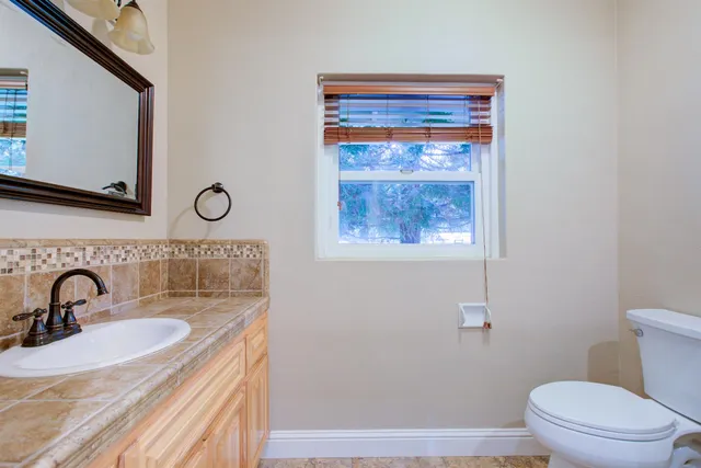 a view of storage and utility room with a refrigerator