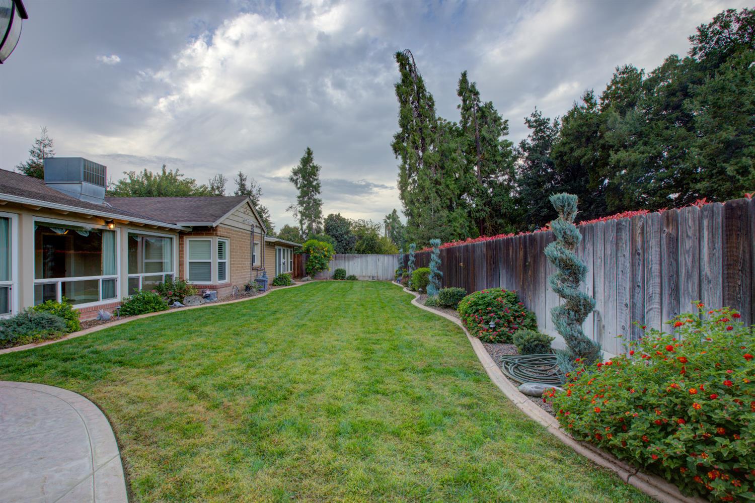 1739 First Street Atwater, CA 95301 - Photo 4 of 58 a view of a house with garden and plants