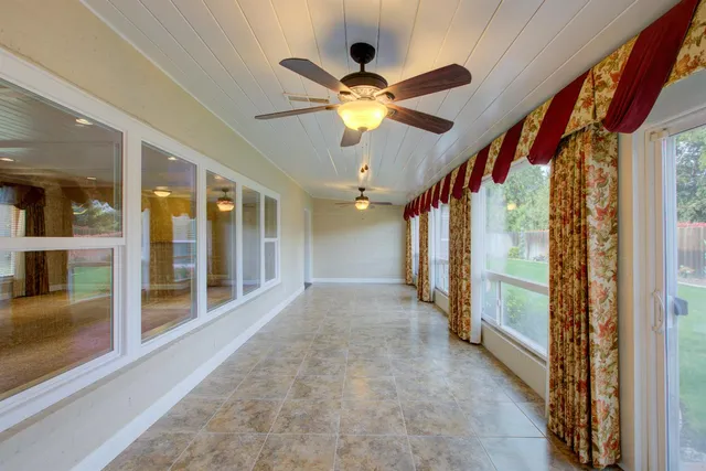 a view of a backyard with swimming pool