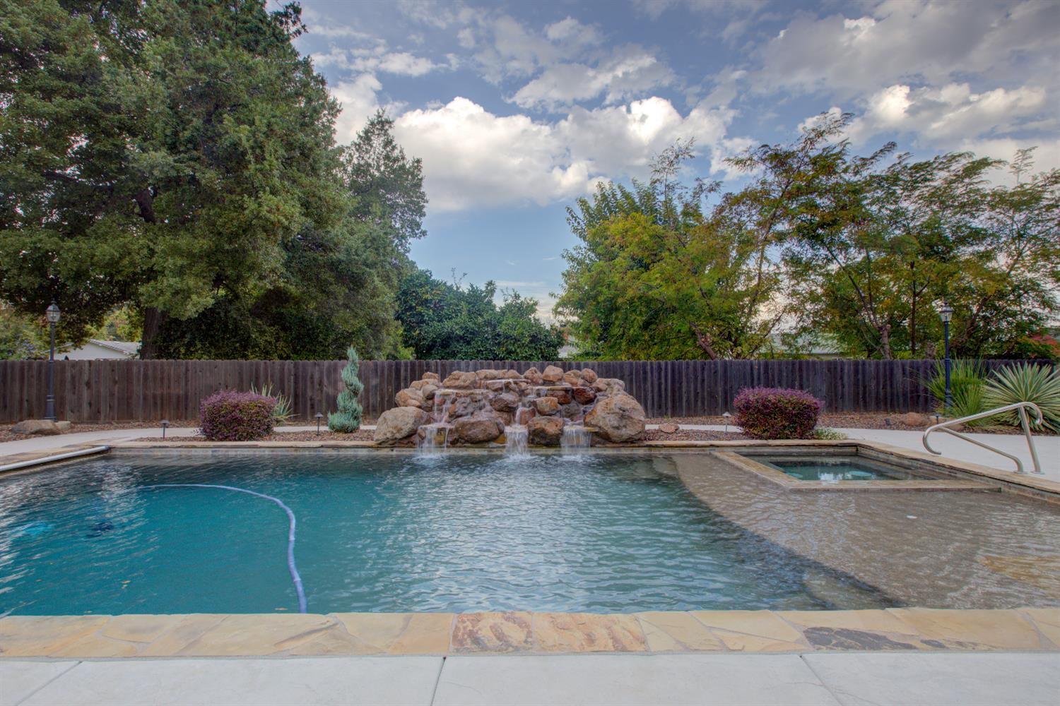 1739 First Street Atwater, CA 95301 - Photo 50 of 58 a view of a backyard with swimming pool