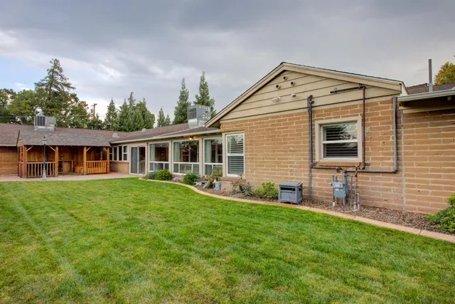 a front view of house with yard and green space