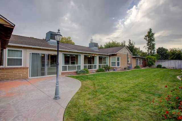 a front view of a house with a yard and porch
