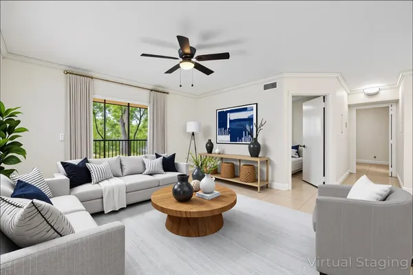 a living room with furniture and a large window