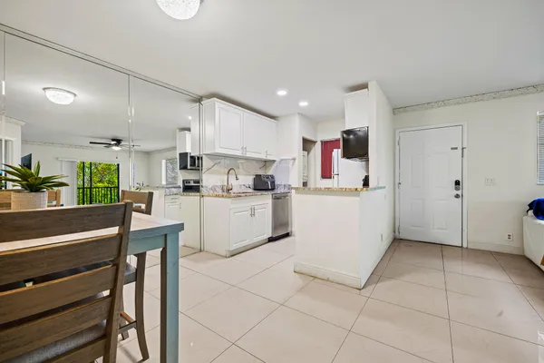 a kitchen with cabinets and white appliances