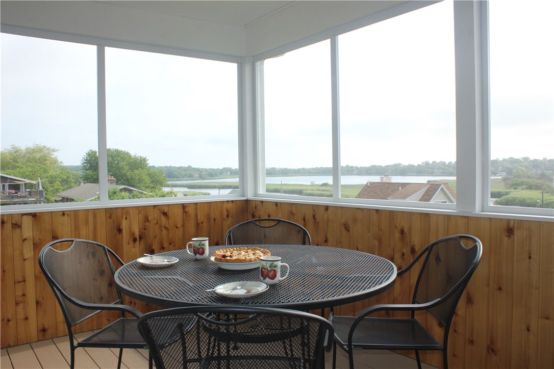46 Conanicut Road Narragansett, RI 02882 - Photo 22 of 36 THE SCREENED-IN PORCH CAN EASILY HOLD A DOZEN PEOPLE.