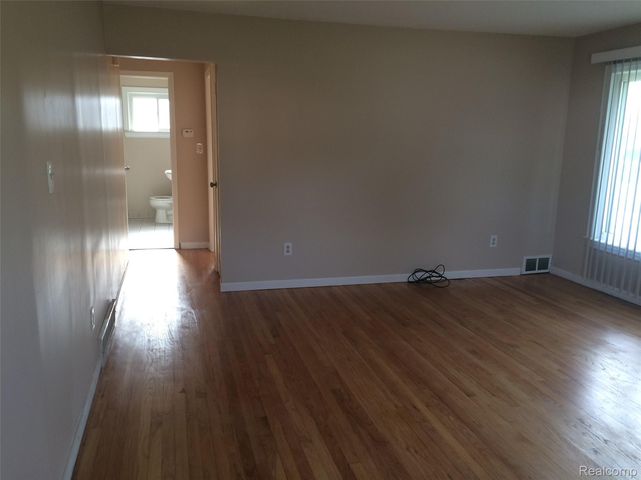 30057 Spring Arbor Drive Inkster, MI 48141 - Photo 5 of 9 Wood-finish flooring throughout, complemented by neutral wall tones