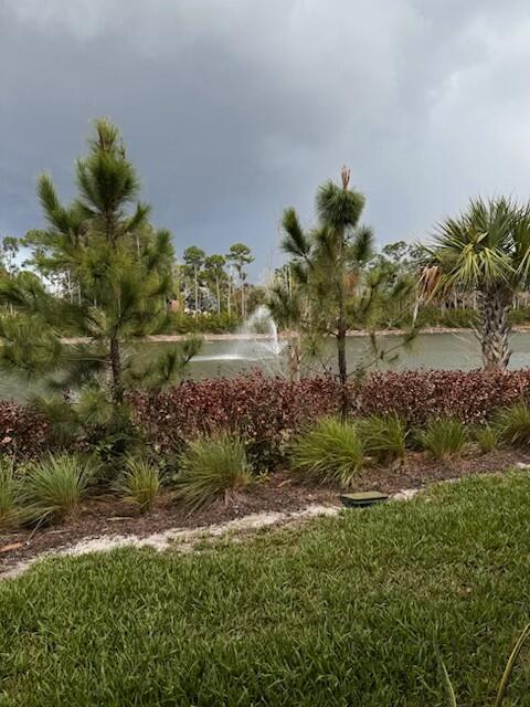 5786 Southeast Edgewater Circle Stuart, FL 34997 - Photo 14 of 15 a view of a garden with a flower in a garden