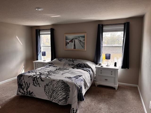 5786 Southeast Edgewater Circle Stuart, FL 34997 - Photo 7 of 15 a bedroom with a bed and window