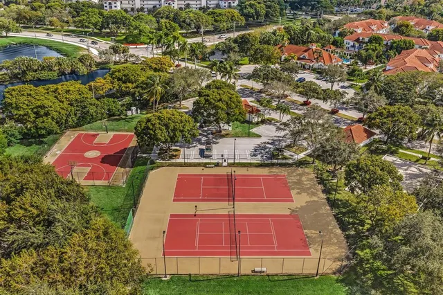 a living room with furniture a flat screen tv and a window