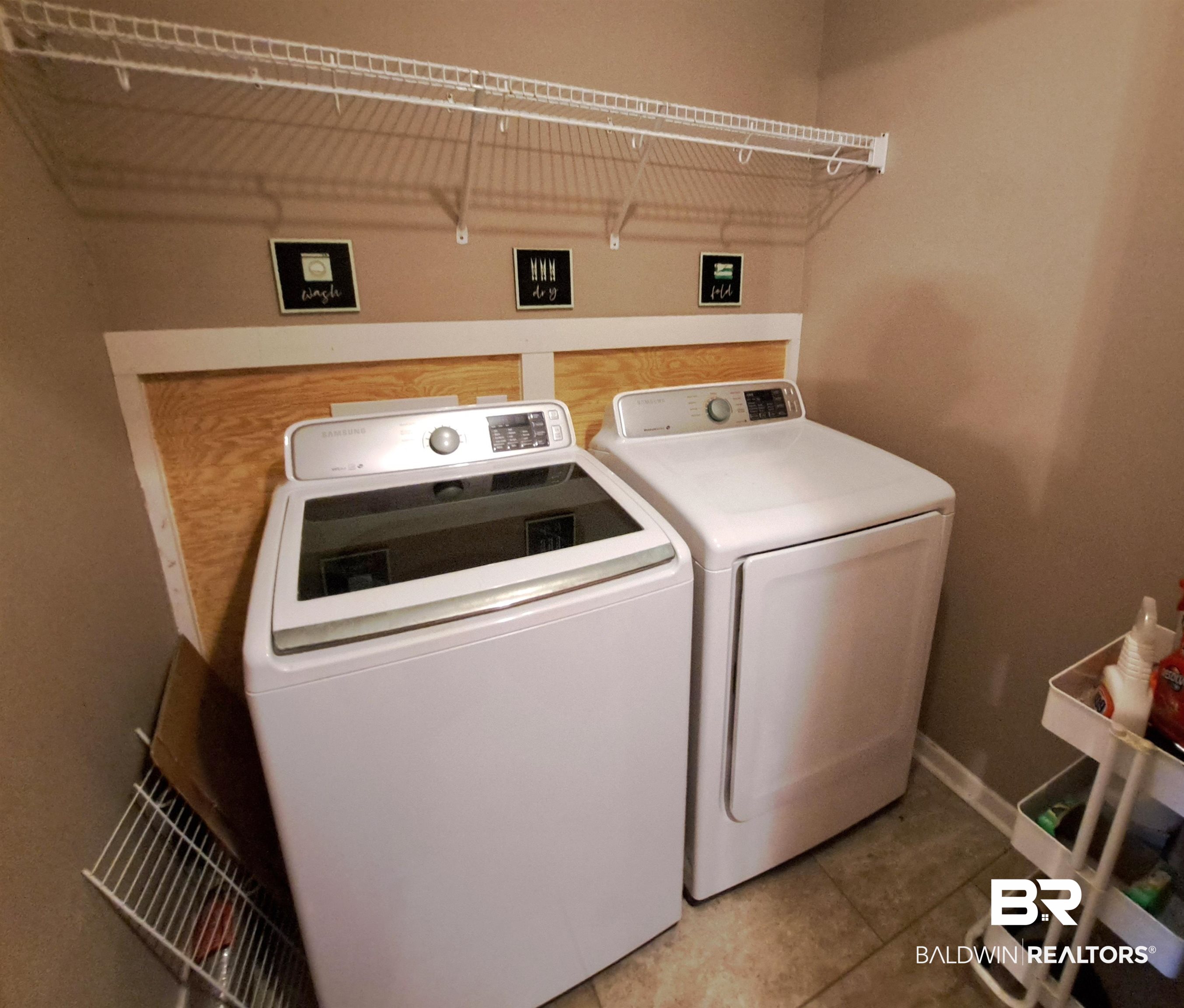 249 Newton Parkway Evergreen, AL 36401 - Photo 10 of 28 Laundry room featuring washer and dryer and light tile patterned floors