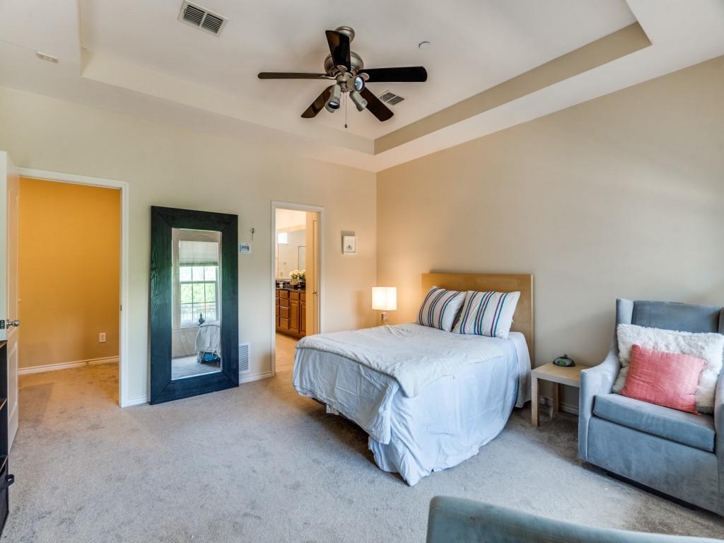 15711 Spectrum Drive, Unit 80 Addison, TX 75001 - Photo 18 of 26 a spacious bedroom with a bed and furniture