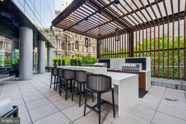 a outdoor dining space with furniture