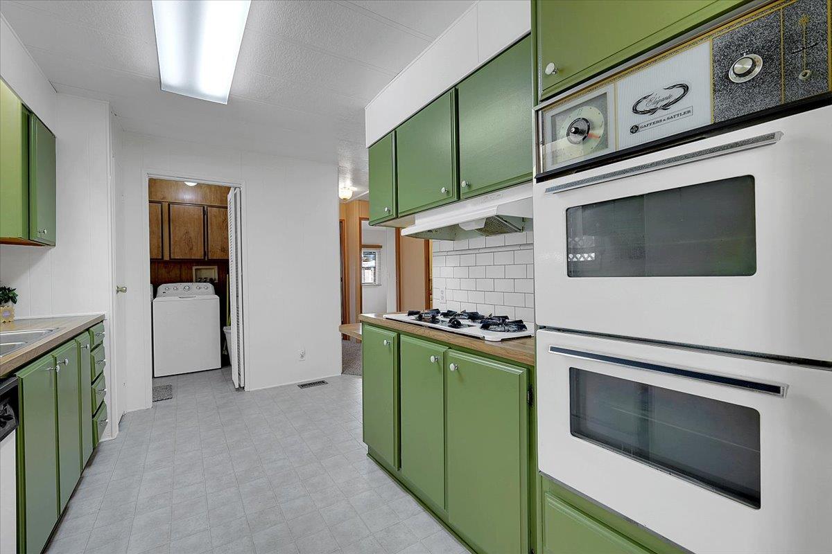 1155 Pease Road, Unit 511 Yuba City, CA 95991 - Photo 15 of 35 a utility room with stainless steel appliances and cabinets