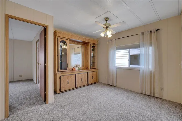 an empty room with a empty space and windows