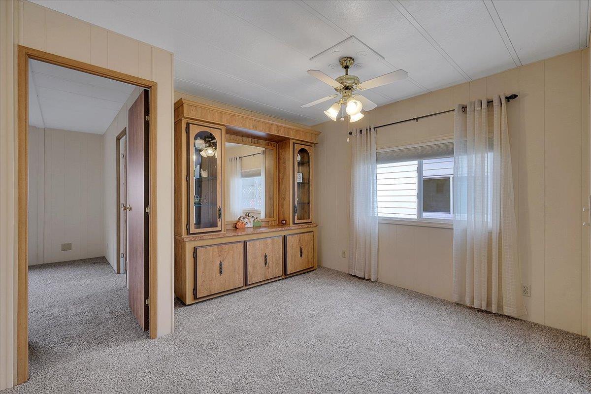 1155 Pease Road, Unit 511 Yuba City, CA 95991 - Photo 18 of 35 a large room with chandelier fan and windows