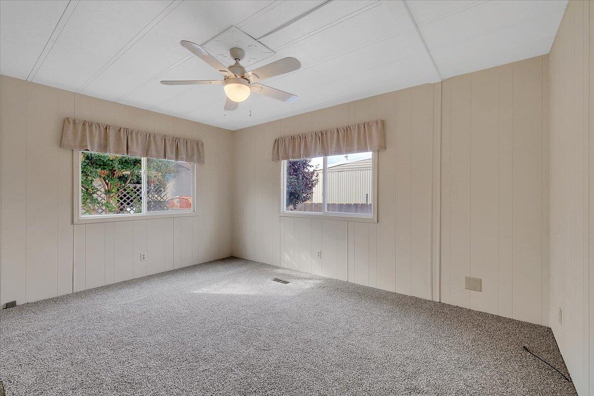 1155 Pease Road, Unit 511 Yuba City, CA 95991 - Photo 23 of 35 an empty room with windows and fan