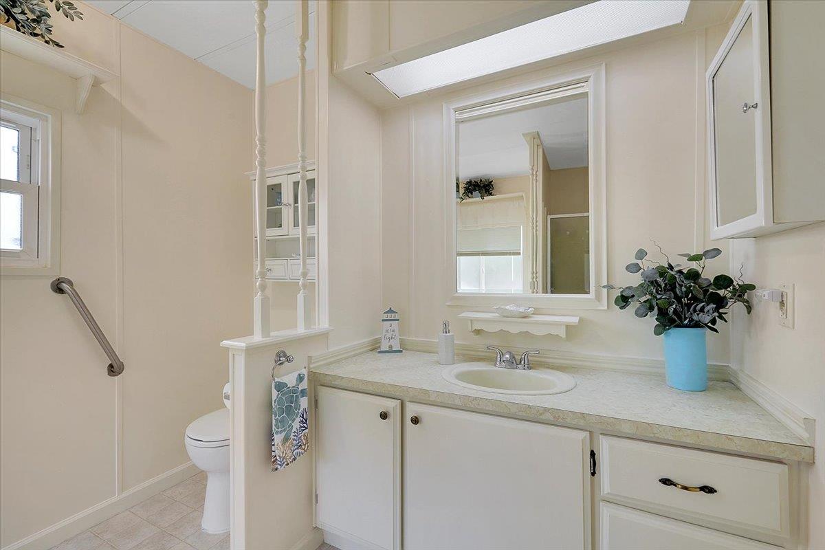 1155 Pease Road, Unit 511 Yuba City, CA 95991 - Photo 25 of 35 a bathroom with a granite countertop sink a toilet and shower