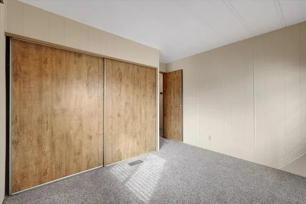 a bathroom with a sink toilet a mirror and shower