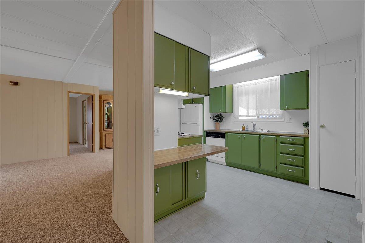 1155 Pease Road, Unit 511 Yuba City, CA 95991 - Photo 10 of 35 a kitchen with a sink cabinets and wooden floor