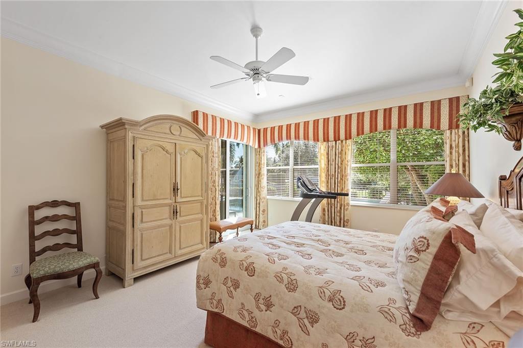 8063 Vizcaya Way Naples, FL 34108 - Photo 11 of 28 a bedroom with a bed and a window