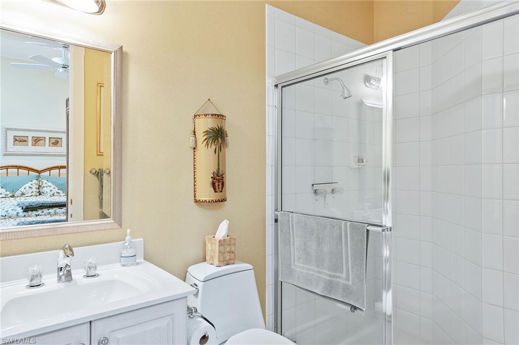 8063 Vizcaya Way Naples, FL 34108 - Photo 14 of 28 a bathroom with a sink toilet and shower