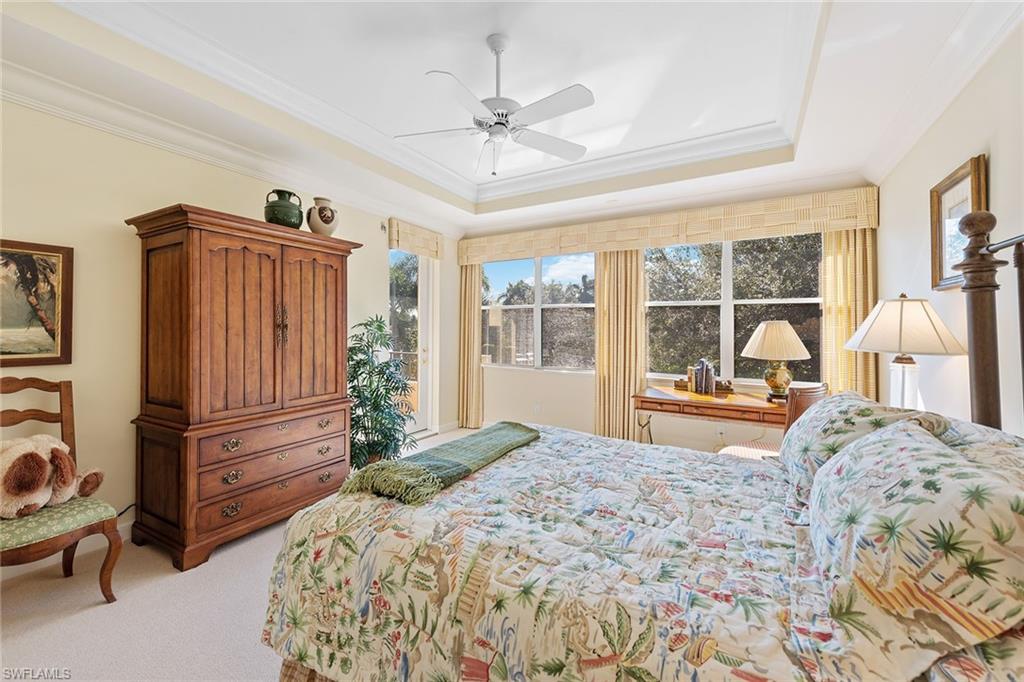 8063 Vizcaya Way Naples, FL 34108 - Photo 15 of 28 a bedroom with a bed and a large window with the outer view