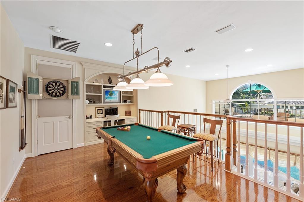 8063 Vizcaya Way Naples, FL 34108 - Photo 19 of 28 a room with furniture and a window